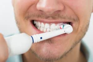 Brushing Teeth with Electric Toothbrush
